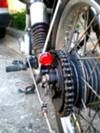 a close up view of the front wheel of a motorcycle parked next to a curb