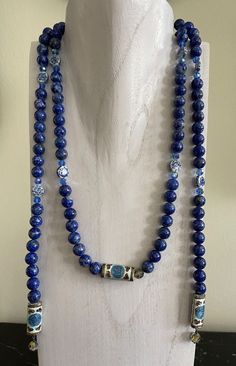 "For your consideration is a fabulous 52\" long Chinese lapis lazuli strand, accented with enameled cloisonné, crystal beads, and porcelain details. The lapis lazuli beads (95 in total) measure 9.6mm; the cloisonné details (5 in total) are 1\" long; the flat porcelain pieces (8 in total) are 10.4mm; and of the 21 crystal beds, the larger are 7.1mm. The stand weights 183 grams, and it is in good vintage condition.   IMPORTANT DISCLAIMERS  We always take plenty of photos and provide detailed descriptions of our items. Therefore, you are asked to please check ALL posted photos and review the Description Section before purchasing an item from our store. Before listing, we clean and inspect our items for neatness and accuracy. However, if a problem with the purchased item arises, we have a very Lapis Lazuli Beads, White Jewelry, I Love Jewelry, Jewellery Design, Chain Styles, Lapis Lazuli, Jewelry Ideas, Crystal Beads, Necklace Lengths