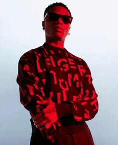 a man wearing sunglasses and a sweater with the word lager printed on it, standing in front of a white background