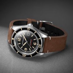 Inspired by the golden age of the dive watch, the Fleuss is built with a nod to nostalgia. Utilizing the best in watchmaking techniques, it's a sturdy, ever-dependable timepiece that goes from beach to boardroom with ease. A soft, lint-free cotton cloth is ideal for when cleaning the case, glass or band of your watch to remove stains and water spots. Vintage Timepiece, Divers Watch, Hand Watch, Vintage Rolex, Military Watches, The Golden Age, Dive Watches, Watch Collection, Black Watch