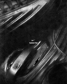 a black and white photo of a computer mouse with the word nota on it