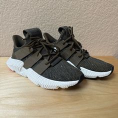 Adidas Prophere Trace Sneakers In Olive. New With Tags! Never Worn! Size On Tag Says 6 (Men’s) But These Fit 7.5 For Women! Small Spots On The Sole From Where They Were Stored But Should Clean Right Off. Size: Men’s 6, Or Women’s 7.5 Thanks For Checking Out This Listing! Adidas Slip-on Synthetic Sneakers, Adidas Synthetic Lace-up Sneakers, Adidas Low-top Running Shoes With Speckled Midsole, Adidas Synthetic Sneakers With Textured Sole, Adidas Casual Running Shoes With Textured Sole, Adidas Sneakers With Textured Sole, Adidas Comfortable Sneakers With Textured Sole, Casual Adidas Lace-up Running Shoes, Adidas Casual Sneakers With Speckled Midsole