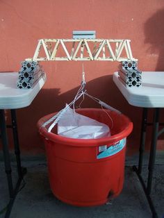 two red buckets sitting next to each other