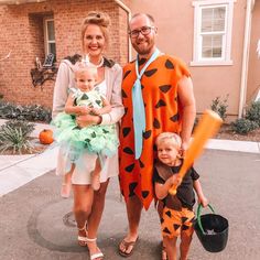 a man, woman and child are dressed up as the flintman and his wife