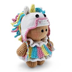 a crocheted stuffed animal wearing a colorful dress