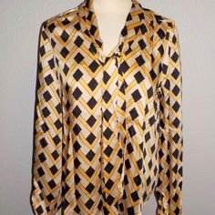 Elie By Elie Tahari Misses Sizes Fashion Blouse Multi-Color Geometric Print On Brown, Yellow/ Gold And Tan Long Sleeves With Single Button Cuff Pull-Over Style V-Neckline Attached Necktie Can Be Worn Various Ways 100% Polyester New With Tags Chic Long Sleeve Blouse With Geometric Pattern, Chic Workwear Blouse With Geometric Pattern, Chic Multicolor Tops With Geometric Pattern, Elegant Long Sleeve Top With Geometric Pattern, Elegant Long Sleeve Tops With Geometric Pattern, Elegant Multicolor Blouse For Work, Spring Workwear Blouse With Geometric Pattern, Chic Multicolor Blouse With Geometric Pattern, Multicolor Geometric Pattern Blouse For Workwear