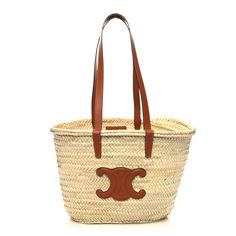 This is an authentic CELINE Raffia Calfskin Triomphe Medium Panier in Tan.This tote is crafted of a light brown woven raffia canvas. It features a brown leather shoulder strap and leather logo patch. The open top leads to an unlined matching woven raffia interior. Luxury Natural Bags With Gold-tone Hardware, Designer Tan Bag With Braided Handles, Designer Tan Bags With Braided Handles, Luxury Natural Shoulder Bag For Shopping, Luxury Tan Shoulder Bag With Braided Handles, Luxury Baguette Shopping Bags, Luxury Baguette-shaped Shopping Bags, Designer Natural Shoulder Bag For Shopping, Luxury Natural Shoulder Bag For Errands