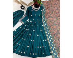 Teal Blue Anarkali Dress For Women Indian Wedding Dress Salwar Kameez Pakistani Salwar suit 3pc Readymade Gown Long Gown wedding Gown Presenting New Designer Collection In Pure Chinnon With Embroidery Sequence Work Gown And Dupatta Set Fully Stitched Ready To Wear  Fabric Detail Top Top Fabric :Pure Chinnon Silk With Embroidery Work With Fancy Full Sleeve Top Inner  :Heavy Micro Cotton Top Length:-48-49Inch Top Size : M(38),L(40),Xl(42),XXL(44) (FULLY STITCHED READY TO WEAR) Palazzo Palazzo Fabr Fitted Anarkali Set In Chinon For Navratri, Floor-length Fitted Dupatta With Mirror Work, Wedding Sets With Mirror Work In Maxi Length, Wedding Sets With Mirror Work And Maxi Length, Fitted Gown With Dabka Work In Chinon, Blue Georgette Anarkali Set For Wedding, Blue Anarkali Gown With Dabka Embroidery, Anarkali Blue Gown With Dabka, Blue Anarkali Set With Dabka Work For Wedding