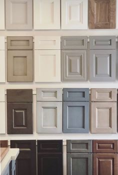 the cabinets are all different colors and sizes