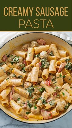 creamy sausage pasta in a skillet on a marble countertop with the title above it