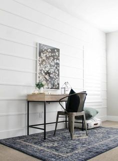 the instagram page shows an image of a desk and chair in a room with white walls