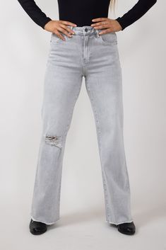 Get the ultimate vintage look with our Mica High Rise Wide Leg Raw Hem Jeans for Women in Grey! These trendy jeans feature a high rise fit that flatters your figure and a distressed design for added edge. Features: Mica Style: MDP-W3313 Color: Grey 93% Cotton 4.8% Polyester 2.2% Spandex Women’s jeans Distressing washed look Distressing at knee High rise waist 5 pockets construction Belt loops with zip and button closure Raw hem Wide leg Measurements from size 26: Front rise: 10” Back rise: 12” Inseam: 30” Waist: 26” Machine wash cold, tumble dry low Trendy Jeans, Raw Hem Jeans, Hem Jeans, Jeans For Women, Vintage Look, Jeans Shop, Vintage Looks, Knee High, Wide Leg