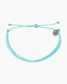 The Isla bracelet from Pura Vida is a cool, blue look with pastel shades that truly light up any look! Made from 100% waterproof cord and so much fun to wear and layer, it can follow you anywhere spring and summer take you - with a little boho flair thrown in!Adjustable from 2-5 Inches in DiameterWax-coated cord is 100% waterproofPura Vida logo charm Pure Vida Bracelets, Angel Bracelet, Prayer Bracelet, Sweet Necklace, Awareness Bracelet, Artisan Bracelets, Rope Necklace