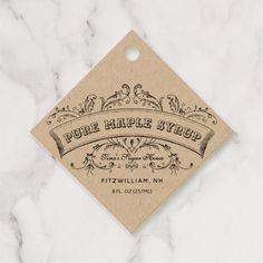 a label for pure maple syrup on a marble surface