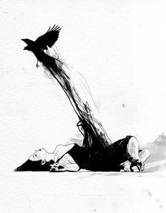 a black and white photo of a person laying on the ground with a bird flying overhead