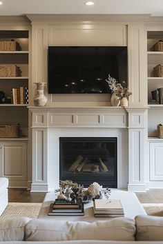 a living room filled with furniture and a flat screen tv mounted above a fire place