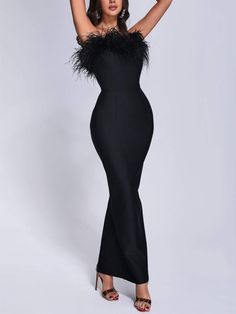 The Feather Maxi Bandage Dress exudes opulence with its lavish feather detailing cascading down a sleek bandage silhouette. This statement piece effortlessly combines glamour and sophistication, making it an unforgettable choice for red carpet events or upscale soirées where you want to make a dramatic entrance and leave a lasting impression. Fitted Sleeveless Evening Dress With Feathers, Fitted Evening Dress With Feather Trim For Night Out, Elegant Feather Trim Evening Dress For Night Out, Elegant Evening Dress With Feather Trim For Night Out, Elegant Feathered V-neck Dresses, Chic Feather Trim Evening Dress For Night Out, Formal Black Evening Dress With Feather Trim, Chic Evening Dress With Feather Trim For Night Out, Fitted Black Evening Dress With Feather Trim