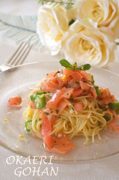 a plate with spaghetti and vegetables on it