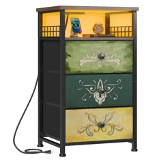 a multicolored cabinet with an electric charger on the top and two drawers below it