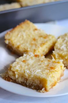 three pieces of cake on a white plate