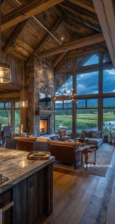 a living room filled with furniture and a fire place in the middle of a kitchen