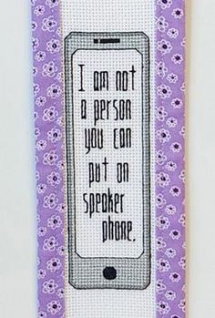 a purple and white bookmark with the words i am not a person you can put on a speaker phone