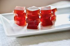 three cubes of jelly on a white plate