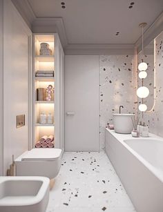 a bathroom with two sinks, a toilet and a bathtub in it's center