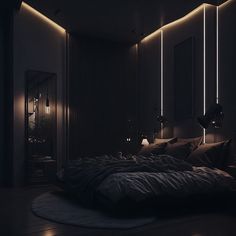 a dark bedroom with lights on the wall and a large bed in front of it