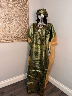 African/Nigeria bubu brocade outfit. One size. Oversized,And  Please note measurements: Width: 64inches Lenght: 62inches Green Loose Fit Long Kaftan, Green Oversized Long Kaftan, Oversized Green Long Kaftan, Oversized Long Green Kaftan, Bohemian Long Gold Kaftan, Long Bohemian Gold Kaftan, Bohemian Gold Long Thobe, Long Gold Bohemian Kaftan, Gold Long Kaftan For Festivals