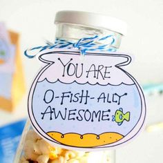 there is a jar with some candy in it that says you are o - fish - all awesome