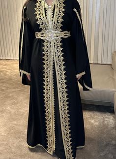 Beautiful Moroccan Kaftan Dress filled with Sparkling Stones and embellishments. Comes with  gold Belt.  Please send measurements for accurate sizing Belt is included  This dress is made with high quality materials. Each piece is made and handled with care and inspected to ensure it's perfect.  Exchange is accepted. No returns. If you have any issues please contact so we can resolve any issues and make sure you're satisfied. You will always receive a quick and personal attention. Elegant Embellished Gold Kaftan, Traditional Gold Embellished Dress, Gold Embroidered Floor-length Abaya, Traditional Gold Dress With Gold Embroidery, Gold Floor-length Abaya With Gold Embroidery, Gold Floor-length Dress For Eid, Gold Floor-length Abaya, Traditional Embellished Gold Dress, Traditional Floor-length Gold Dress