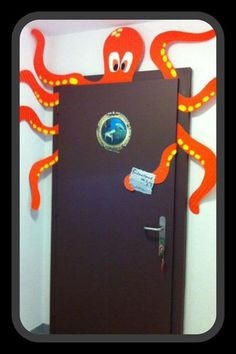 an octopus is standing in front of a door decorated with stickers and magnets