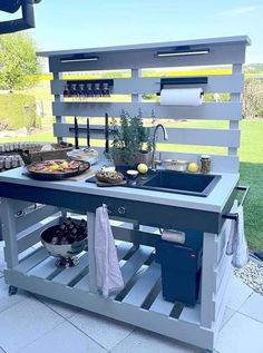 an outdoor kitchen made out of pallets