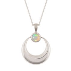 This minimalist crescent moon pendant is simple and elegant. I've carved the pendant in wax, then cast it in solid sterling silver. I have then finished it to a mirror shine before hand setting a gorgeous Ethiopian Welo Opal. The pendant measures 22mm wide by 30mm tall. Stones measure 6mm. Comes with an 18 inch sterling silver spiga chain. You can find the matching earrings here: https://www.etsy.com/listing/265447793/sterling-silver-crescent-moon-earrings?ref=shop_home_active_1 Insured US shipp Celestial Silver Oval Necklace, Silver Oval Celestial Necklace, Sterling Silver Oval Moon Phase Necklace, Sterling Silver Celestial Necklace With Polished Finish, Hand Forged Sterling Silver Celestial Necklace, Engraved Sterling Silver Crescent Jewelry, Celestial Crescent Sterling Silver Jewelry, Celestial Style Necklaces With Polished Round Pendant, Celestial Necklaces With Polished Round Pendant