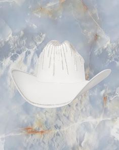 Sell your soul to the Solar Eclipse hat. The Solar Eclipse white cowboy hat is detailed with crystal around the crown and brim. Proudly American Made. Our hats are manufactured in Mexico and details added by hand in Los Angeles, CA using the highest quality materials. SIZING S/M 19in-22.75in | 48cm-57.5cm L/XL 19.5in-23.25in | 49.5cm-59cm **Please allow up to 2 weeks for production and shipping.* If you need your order rushed, please send us an email. We can almost always accommodate rushed orders at no additional cost.* CUSTOM OPTIONS AVAILABLE! Sell Your Soul, White Cowboy Hat, Garden Party Bridal Shower, Parisian Summer, Bridal Fabric, Welcome To The Party, Hand Painted Rocks, Solar Eclipse, Cowboy Hat