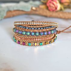 "A super wrap bracelet that features a unique combination of different stones in different shapes. WRAPS UP 4-5 TIMES: Three adjustable closures measure approx. 33\", 34\", 35\" respectively. Get the perfect custom fit on your wrist. Then trim off the extra leather. The size of the round shape silver button is 0.5\"/12MM" Adjustable Wrap Bracelet With Round Natural Stones, Adjustable Spiritual Wrap Bracelet With Natural Stones, Spiritual Adjustable Hand Wrapped Bracelet, Adjustable Natural Stones Wrap Bracelet, Unique Hand Wrapped Healing Wrap Bracelet, Unique Natural Stones Wrap Bracelet For Healing, Adjustable Fusion Gemstone Beaded Bracelets, Spiritual Wire Wrapped Bracelet With Round Beads, Adjustable Stackable Agate Bracelets