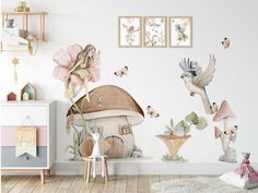 a room with wall decals that have flowers and birds flying around the mushroom house