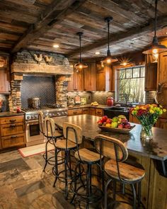 a large kitchen with wooden cabinets and an island in the center, surrounded by bar stools