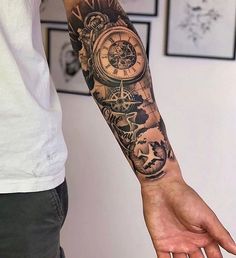 a man with a clock tattoo on his arm