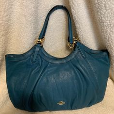 Dark Teal Soft Pebble Leather. Magnetic Snap Closure. Leather Handles W/9-1/2” Drop. Gold Hardware. 1 Inner Zip Pocket & 2 Multifunctional Slip Pockets. Teal Fabric Interior. Excellent Condition. Teal Fabric, Dark Teal, Leather Handles, Dream Wardrobe, Leather Handle, Pebbled Leather, Coach Bags, Gold Hardware, Snap Closure