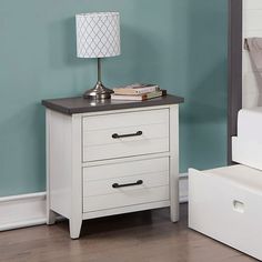 a night stand with two drawers and a lamp on the end table next to it