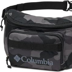 a black and grey camo fanny bag with columbia logo on the front, attached to a belt