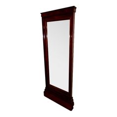 a tall wooden mirror sitting on top of a white floor next to a wall mounted shelf