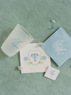 the wedding stationery is laid out on the table