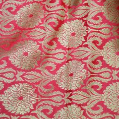 Indian Carrot Red Brocade Indian Banarasi  Fabric For Wedding Dress Kurta Jacket Tie Fabric Blended Silk by the Yard Fabric Sewing crafting. This is a beautiful heavy benarse blended silk brocade floral design fabric in Carrot Red and Gold.  ➤Product: Brocade Fabric ➤Fabric Type: Blended Silk (Viscose and Silk) Fine quality Zari Brocade Weaving from Banaras ➤Color: Carrot Red and Gold ➤Width: 44 inches. ➤Condition: New ➤ Code: bg1009 ➤Listing for 1 Yard of fabric. ➤Care: Dry Clean Only You can use this fabric to make Dresses, Tops, Blouses, Jackets, Crafting, Clutches or Evening Bags, Embellish your clothes, Pillows, Drapery, Home Décor, Outdoor, Quilting, Sewing, General, Upholstery etc use it for scrap booking projects. If you purchase more than 1 Yard you will get it in running length, Red Brocade Blouse Piece With Zari Work, Red Brocade Blouse Piece With Pallu, Festive Red Brocade Blouse Piece, Red Brocade Blouse Piece For Festive Occasions, Elegant Red Brocade Blouse Piece, Traditional Red Brocade Blouse Piece, Red Brocade Blouse Piece In Traditional Drape, Red Brocade Blouse For Festivals, Red Brocade Blouse Piece For Festivals