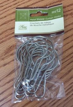 a package of metal shower curtain hooks