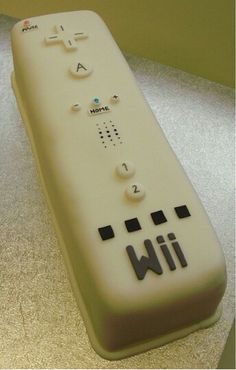 a cake shaped like a nintendo wii controller