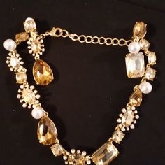 Signed Oscar De La Renta Signed Multi-Color Necklace & Earring Set Non Gem Champagne, Amber-Yellowish, And Faux Pearl Gold Tone Finish Lobster Claw Claps Adjustable Up To 18" Clip-On Earrings Just Over 3/4" X 3" Long Both The Necklace And Each Earring Are Signed On The Back (As Shown In The Photos) Price Is For Both The Necklace And The Earrings, Being Sold As A Set Nwot, Never Worn Formal Yellow Jeweled Jewelry, Elegant Yellow Necklace For Party, Yellow Jeweled Jewelry For Party, Elegant Yellow Jewelry With Sparkling Stones, Multi Coloured Necklaces, Color Necklace, Gold Cream, Necklace Earring Set, Lobster Claw