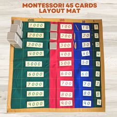 the montessori game is laid out on top of a wooden table with numbers